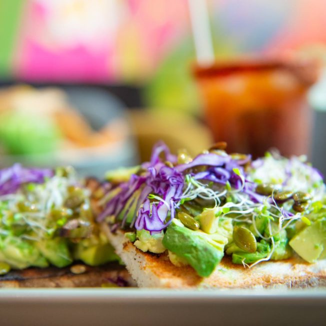 avocado toast with red cabbage and pumpkin seeds