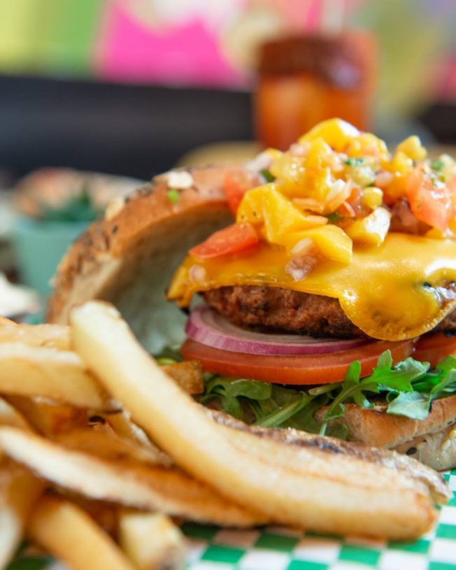 Impossible burger with mango pico next to french fries