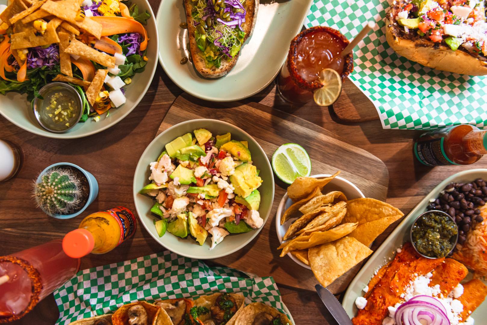 Top down table view of a variety of vegan mexican dishes